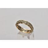 A 9CT GOLD FULL ETERNITY RING, set with circular cut colourless stones assessed as spinel,