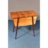 A MID 20TH CENTURY SEWING BOX, made up of plywood, the hinged lid enclosing two compartments and