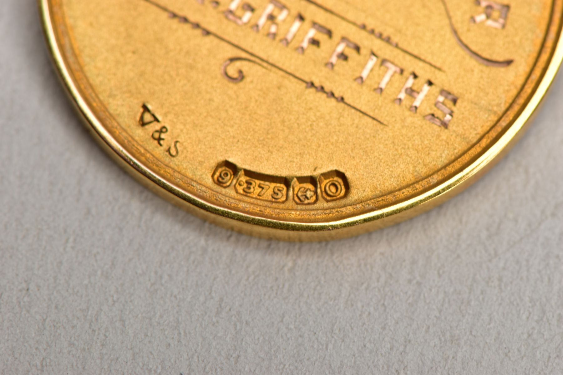 A 9CT GOLD FOB MEDAL, of a circular form, engraved to the front 'I.C.I' within a foliate wreath, - Image 4 of 5