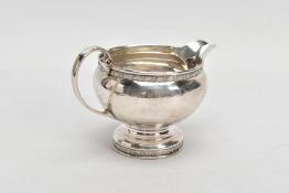 A MID 20TH CENTURY SILVER CREAM JUG, plain polished baluster form, scroll detailed handle, with a