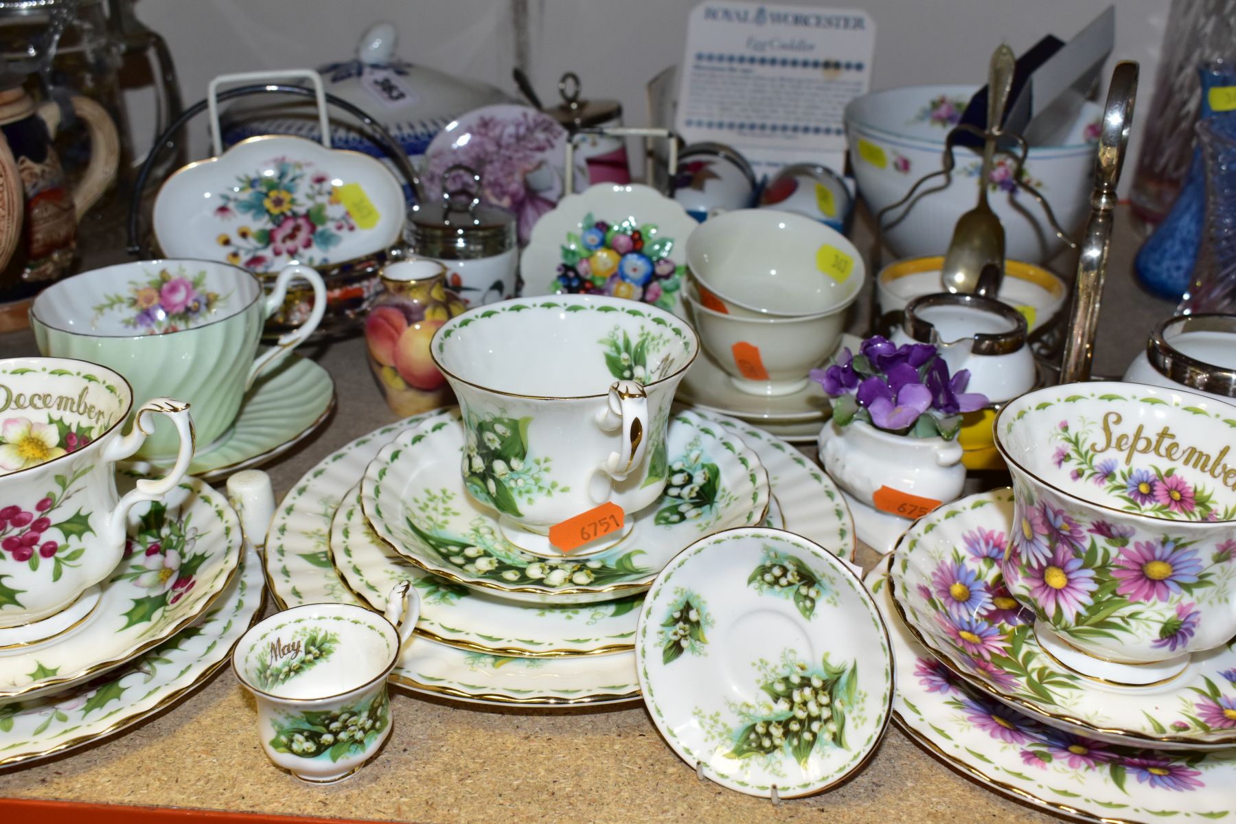 A GROUP OF CERAMICS, comprising Royal Albert Flowers of The Month December and September trios and