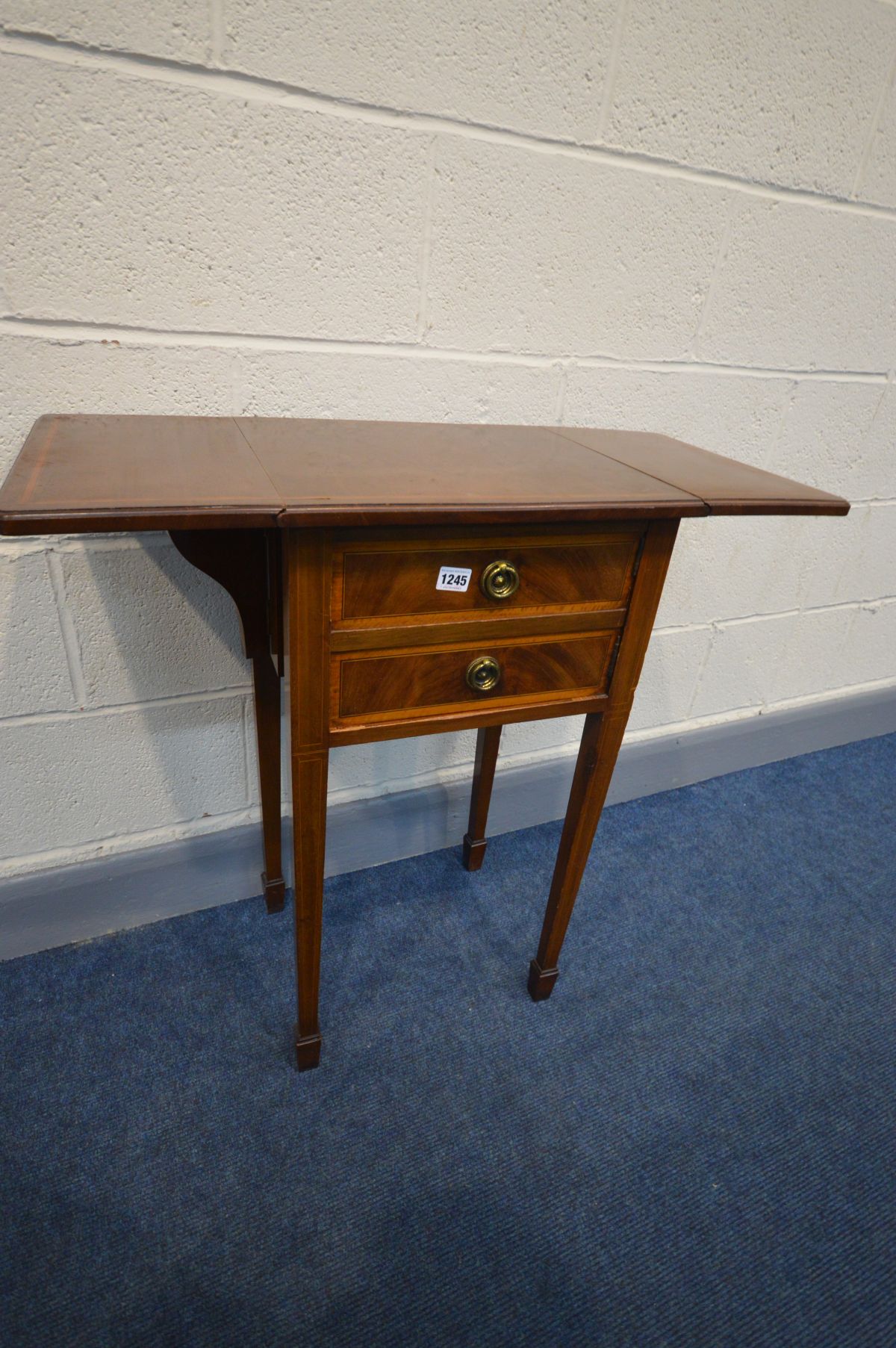 AN EDWARDIAN MAHOGANY AND INLAID DROP LEAF POT CUPBOARD, with a single cupboard, on square tapered