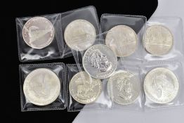 A PARCEL OF SILVER COINS to include two Liberties 2004 and 2005, two Canada Maples 2004, 2005,