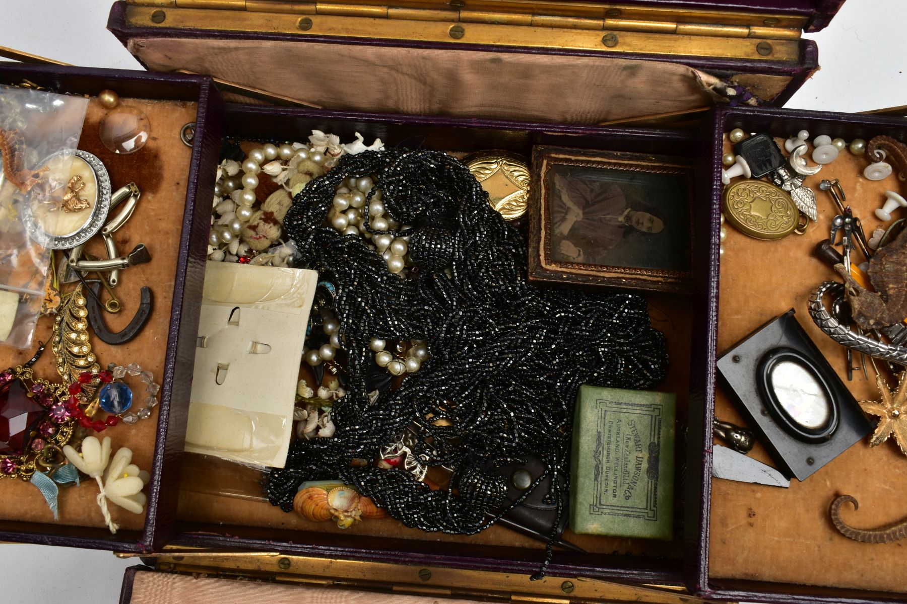 A HINGED BOX OF MAINLY COSTUME JEWELLERY, to include a jet book charm engraved with a church and - Image 3 of 9