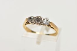 A YELLOW METAL THREE STONE DIAMOND RING, designed with three graduated round brilliant cut diamonds,