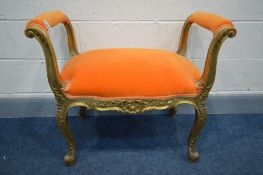 A LOUIS XV STYLE GILTWOOD STOOL, with open armrests, reupholstered in bright orange upholstery,