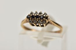 A 9CT GOLD CLUSTER RING, designed with a row of five circular cut blue sapphires, within two rows of