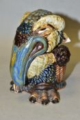 AN ANDREW HULL POTTERY STONEWARE GROTESQUE BIRD JAR AND COVER, predominantly in brown, green, blue