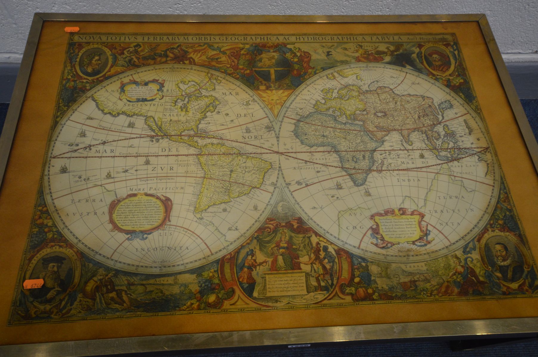 A MAHOGANY AND BRASS BANDED COFFEE TABLE, depicting a world map in two globes, with a glass top - Image 2 of 3
