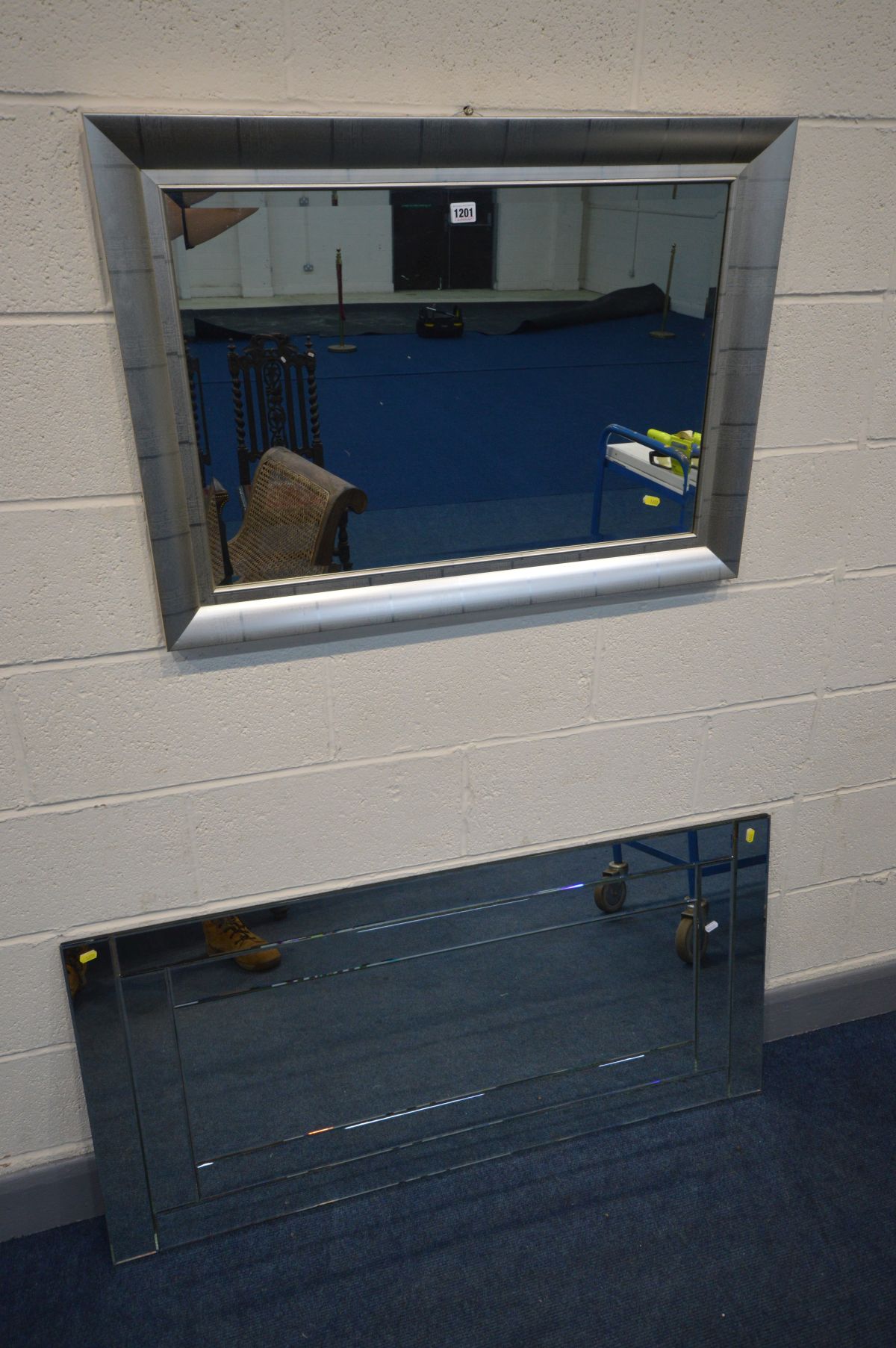 A MODERN GREY BEVEL EDGED WALL MIRROR, 65cm x 90cm together with a mirrored frame wall mirror, 127cm