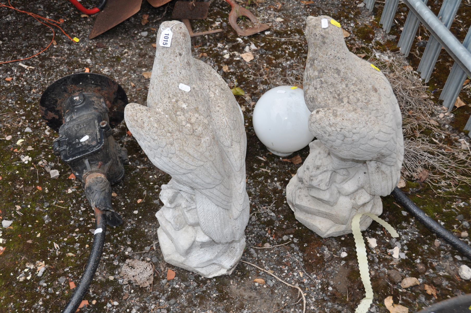 A PAIR OF COMPOSITE GARDEN FIGURES in the form of Eagles standing on a craggy rock 62cm high - Image 2 of 2