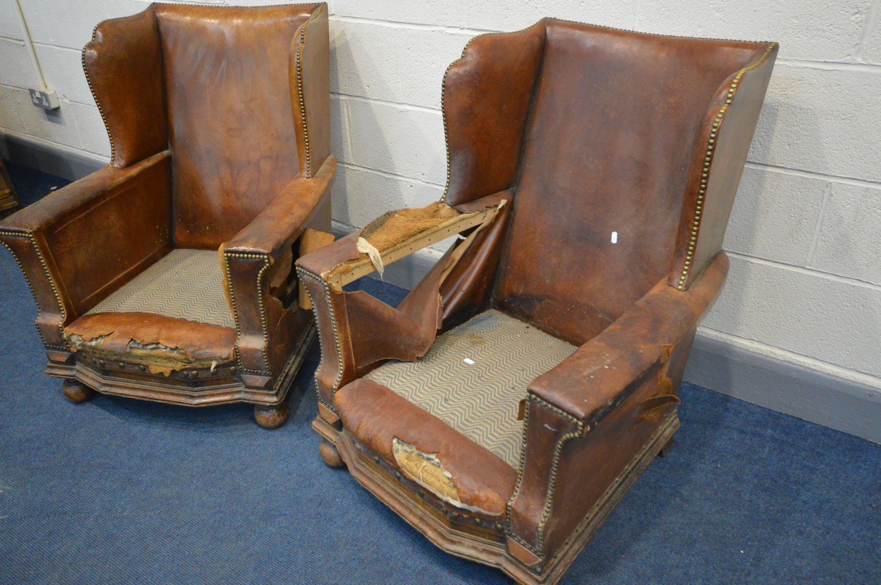 A PAIR OF DISTRESSED EARLY 20TH CENTURY BROWN LEATHER WINGBACK CLUB CHAIRS, on front bun feet, width - Image 3 of 7