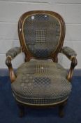 A VICTORIAN STYLE WALNUT OPEN ARMCHAIR with an oval back, width 73cm x depth 81cm x height 99cm