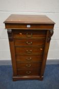A LATE VICTORIAN MAHOGANY WELLINGTON CHEST, of six drawers, with a hinged lockable stile, width 55cm