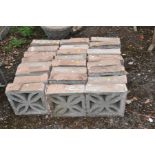 TWENTY FOUR DECORATIVE GARDEN WALL BLOCKS with pierced quatrefoil detail to each