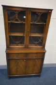 A MAHOGANY BOOKCASE with two drawers, width 92cm x depth 41cm x height 169cm (key)