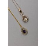 TWO 9CT GOLD GEM SET PENDANT NECKLACES, the first pendant of a tear drop shape, set with a central