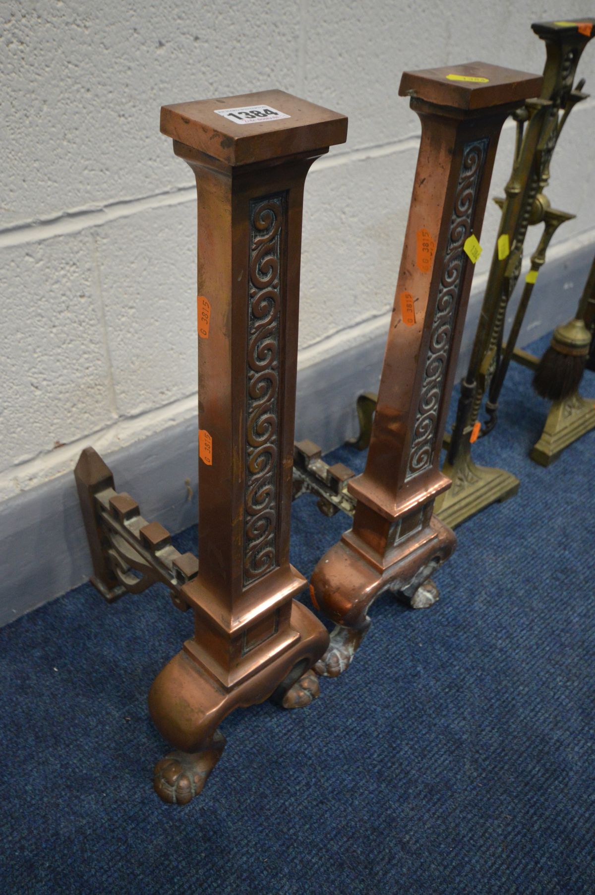 A PAIR OF COPPER ANDIRONS, and another pair of brass andirons with four fire irons (4) - Image 2 of 3