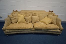 A WALNUT AND GOLD UPHOLSTERED DURESTA HORNBLOWER KNOWLE SOFA, with drop ends to each end, on