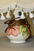 A MOORCROFT POTTERY BALUSTER TABLE LAMP, decorated with coral Hibiscus on a cream ground,