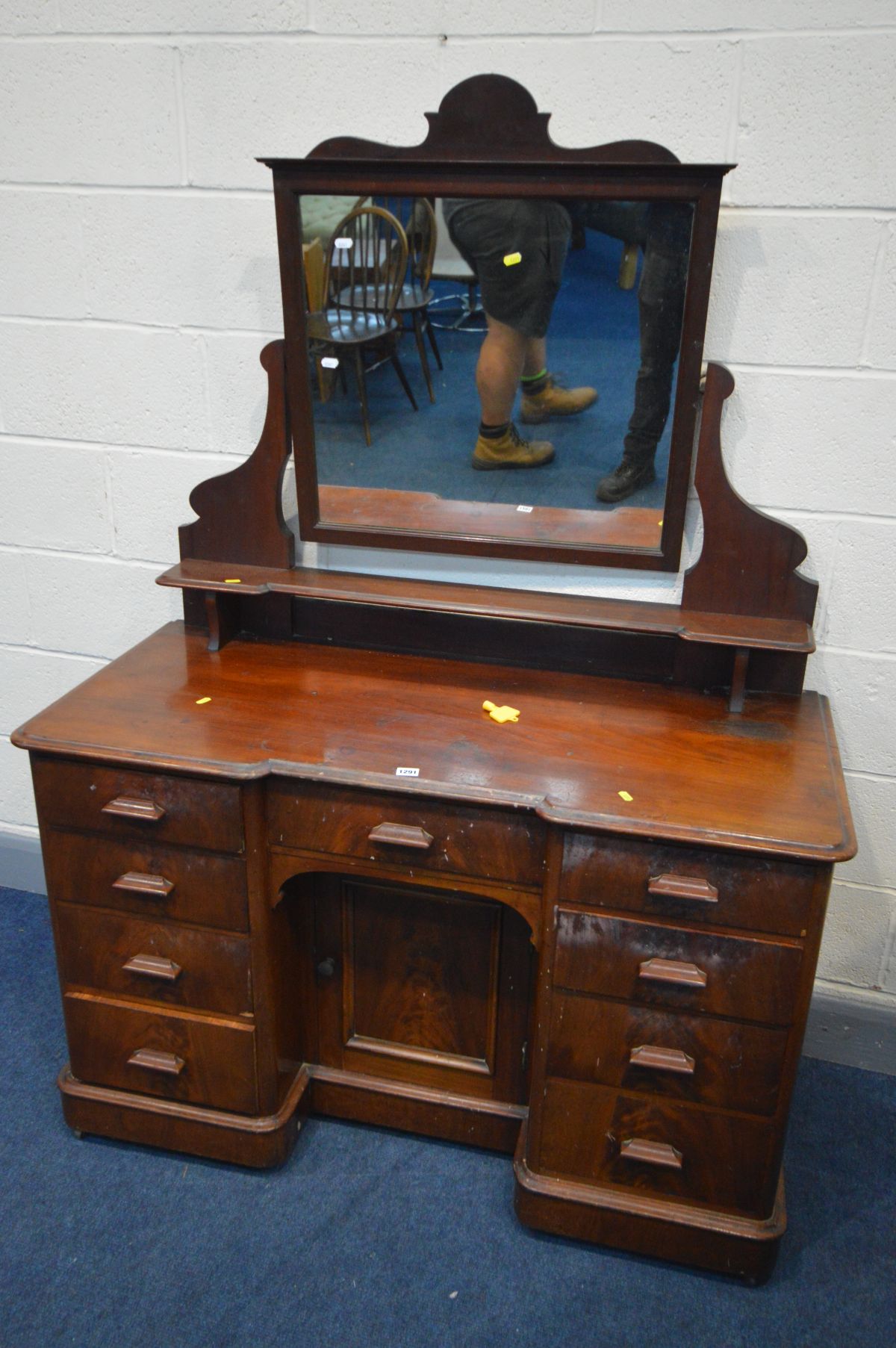 A VICTORIAN FLAME MAHOGANY DRESSING CHEST, with a single mirror, nine drawers and cupboard door,