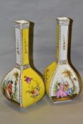 A PAIR OF EARLY 20TH CENTURY GERMAN PORCELAIN BOTTLE SHAPED VASES OF SQUARE FORM, glazed with