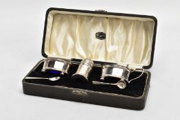 A THREE-PIECE SILVER CONDIMENT SET, comprising of a salt and mustard each with a blue glass