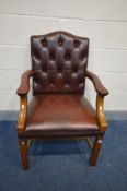 A BURGUNDY BUTTONED LEATHER GAINSBOUGH ARMCHAIR, width 62cm x depth 63cm x height 99cm (