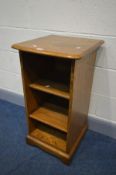 A SMALL ERCOL GOLDEN DAWN OPEN BOOKCASE, with a pull out slide, width 44cm x depth 46cm x height