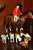 A BESWICK HUNTSMAN, No.1501, brown horse (nibbles to horse's ears), a set of four Foxhounds, Nos.941