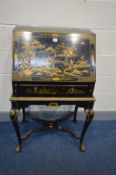AN JAPANNED EBONISED AND PARCEL GILT BUREAU, with chinoiserie decoration, the fall front enclosing a