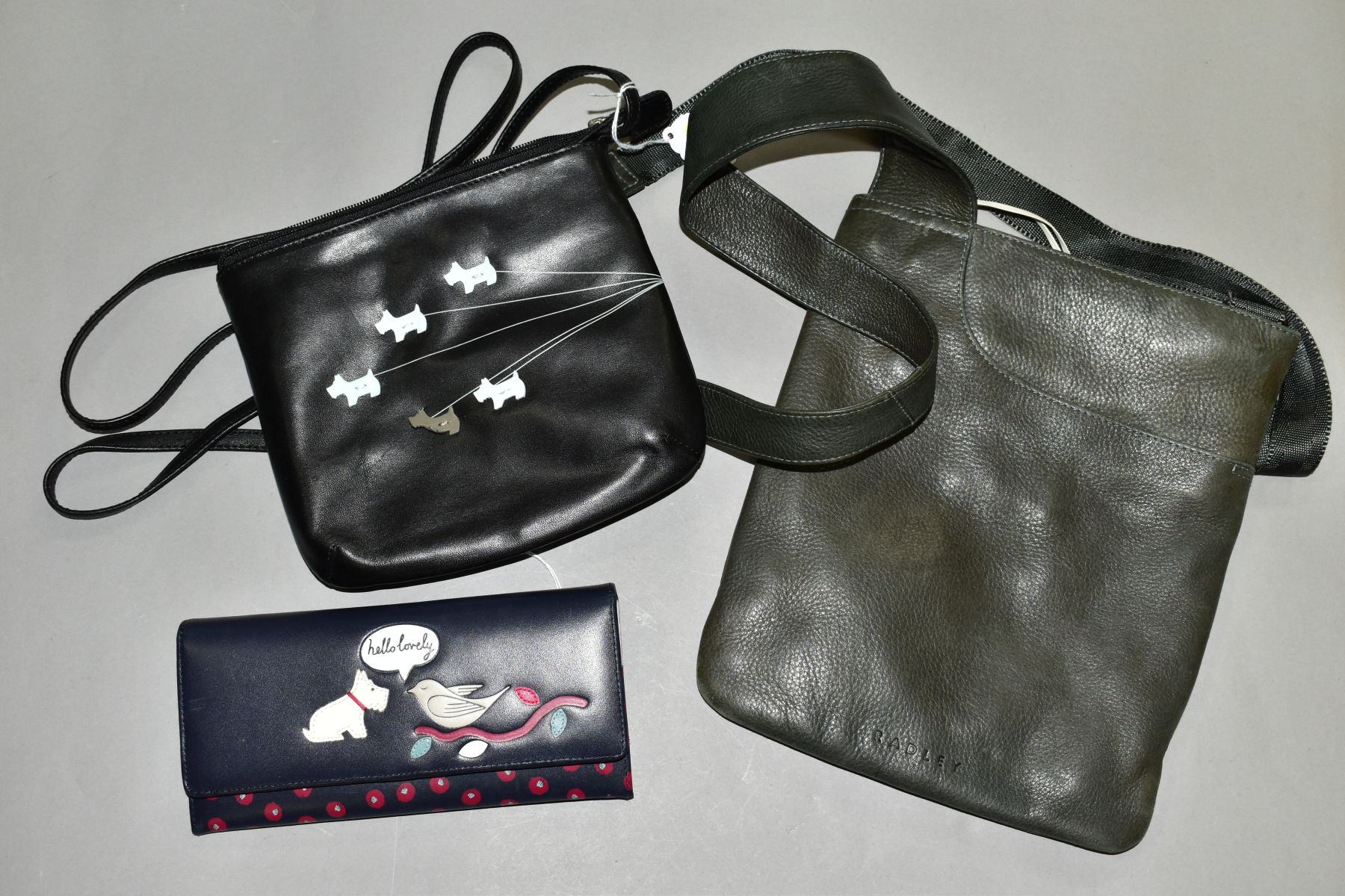 FIVE RADLEY ITEMS:- THREE HANDBAGS WITH DUSTBAGS, PURSE AND SPARE DOG POUCH, comprising dark olive - Image 2 of 3