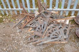 A QUANTITY OF VICTORIAN CAST IRON BRACKETS apparently to support an orangery roof