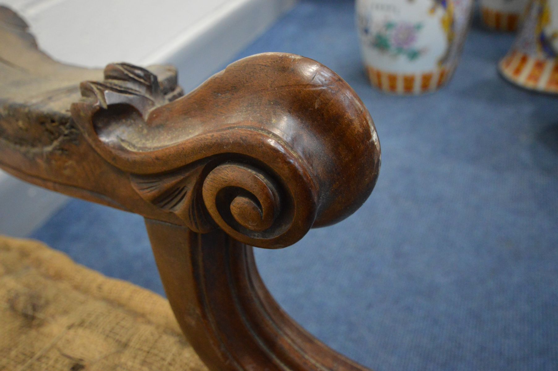 A VICTORIAN WALNUT OPEN DOUBLE BACK SOFA, the frame carved with foliate scrolls, shield centre - Image 8 of 13