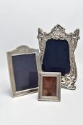 THREE SILVER PICTURE FRAMES, to include a large floral and foliate embossed frame, hallmarked 'S