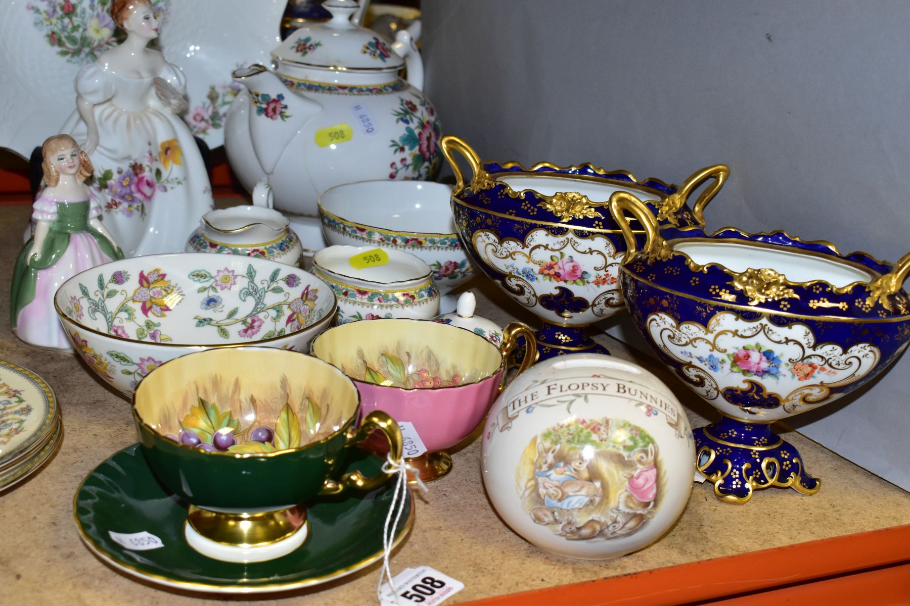 A GROUP OF CERAMIC TEAWARES, GIFTWARE AND ORNAMENTS, comprising two Aynsley 'Orchard Gold' by D