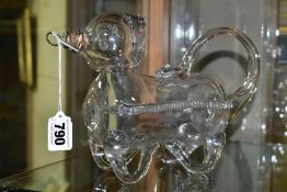 A NOVELTY GLASS DECANTER IN THE FORM OF A BEAR OR GIN PIG, free blown form with cork and metal