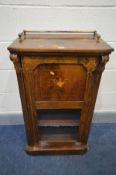 A LATE VICTORIAN WALNUT AND STRUNG INLAID SINGLE DOOR MUSIC CABINET, with a brassed gallery top,