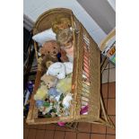 A WICKER DOLLS CRIB CONTAINING A COLLECTION OF ASSORTED MODERN SOFT TOYS AND DOLLS, crib