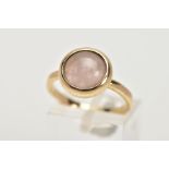 A 9CT GOLD ROSE QUARTZ RING, the circular rose quartz cabochon in a collet setting to the plain