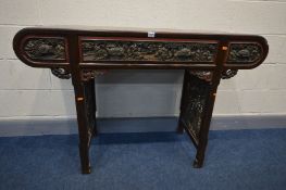 AN ORIENTAL HARDWOOD SIDE TABLE, carved chinoiserie drawer fronts and similar open fretwork side
