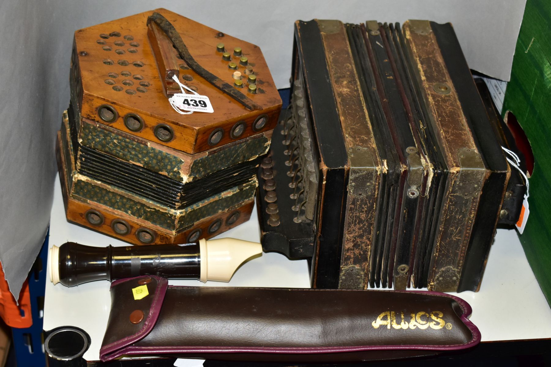 TENOR RECORDER IN SOFT CASE, AN ACCORDIAN AND A CONCERTINA, the late 19th/early 20th Century