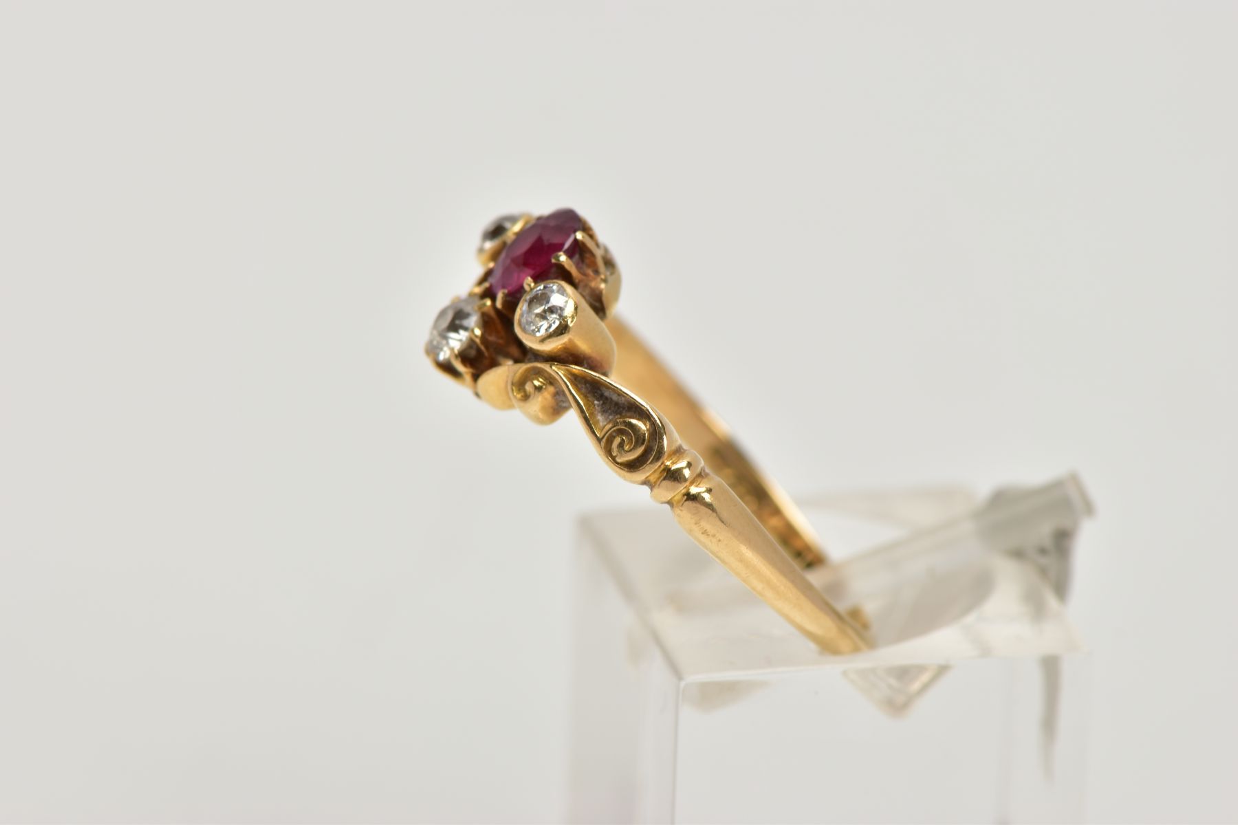 A YELLOW METAL RUBY AND DIAMOND DRESS RING, designed with a cushion cut ruby, flanked with old cut - Image 2 of 4