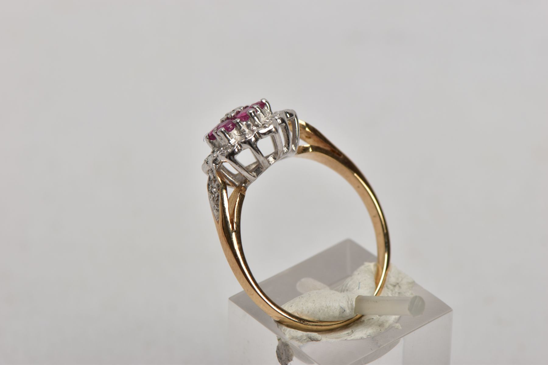 A 9CT GOLD RUBY AND DIAMOND CLUSTER RING, the three tier cluster set with a central single cut - Image 2 of 4