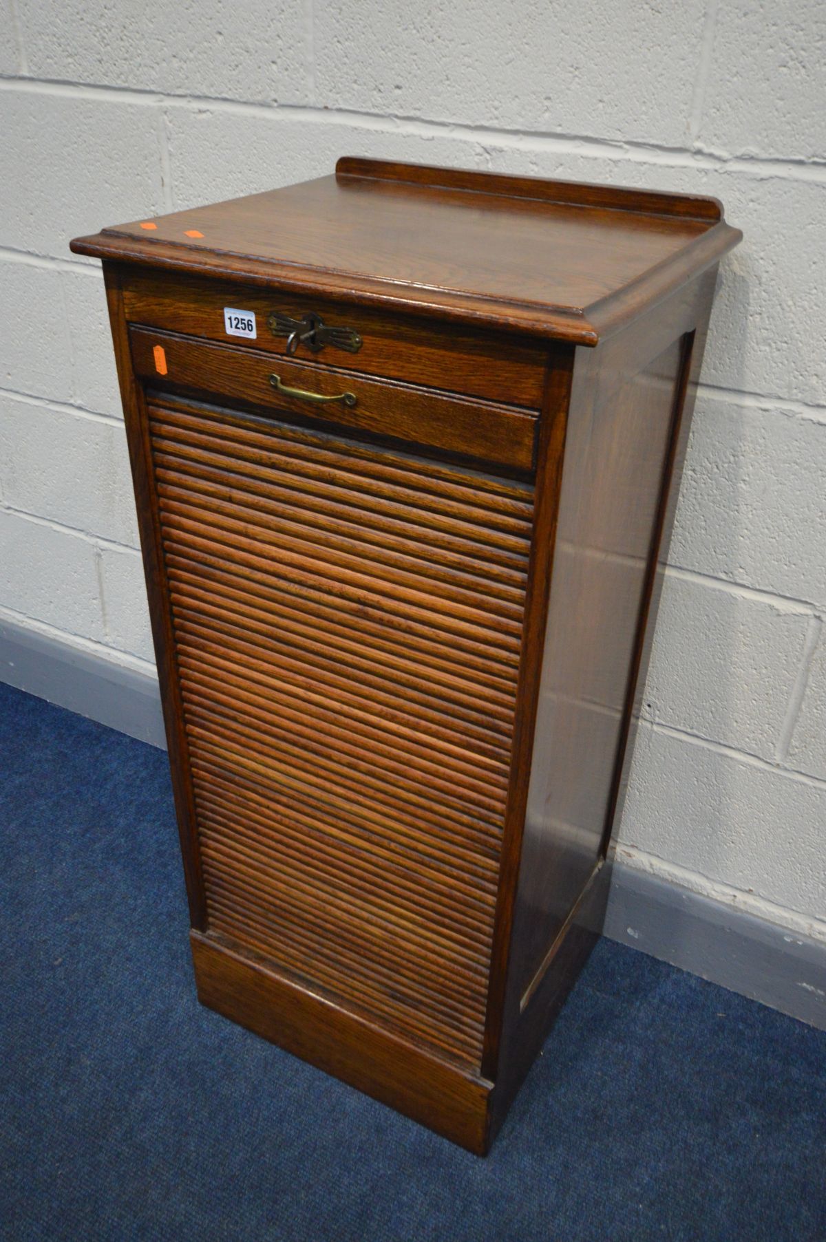 A MID 20TH OAK TAMBOUR FRONT FILING CABINET, with nine drawers, width 48cm x depth 41cm x height