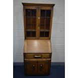 A 1940'S OAK BUREAU BOOKCASE, width 76cm x depth 50cm x height 199cm (key)