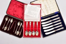 TWO CASED SETS OF SILVER TEASPOONS AND A CASED SET OF SILVER HANDLED BUTTER KNIVES, the first set of