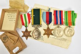 A BOXED GROUP OF WWII MEDALS to include, 1939-45, Italy Stars, Defence & War medal, together with