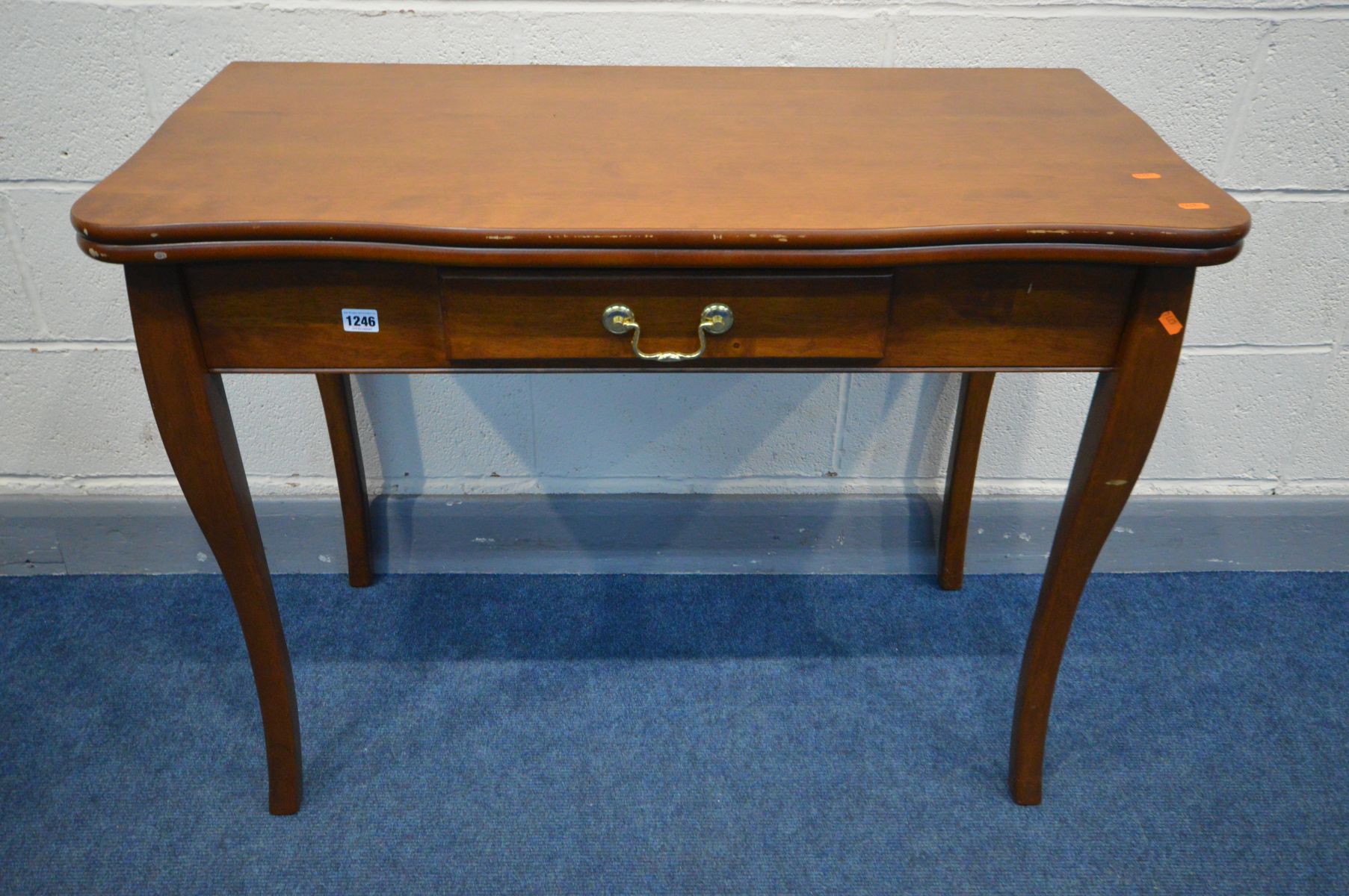 A STAKMORE HARDWOOD CONSOLE/EXTENDING DINING TABLE, with two additional leaves, extended dining