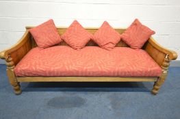 A 19TH CENTURY OAK HALL SETTLE, with panelled sides and back, and scrolled armrests, on turned front